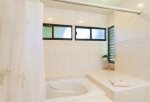 The master bath is high-end remodel with large soaking tub, 2 separate vanities, custom lighting and private toilet